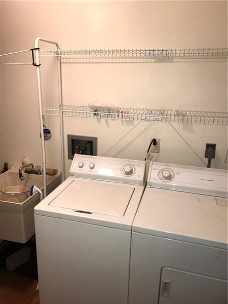 Washer, Dryer, and wash tub.  All on the first flo