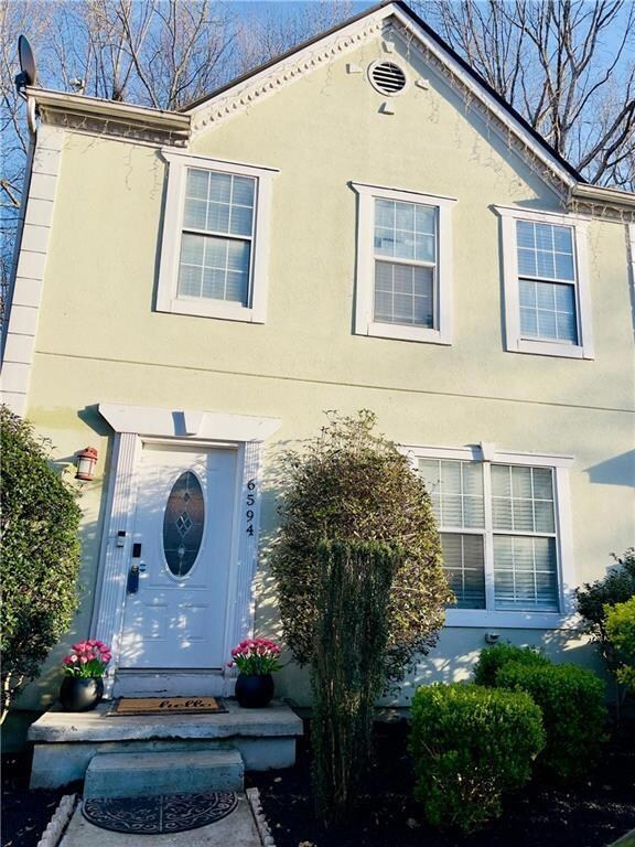 View of front of property featuring stucco siding