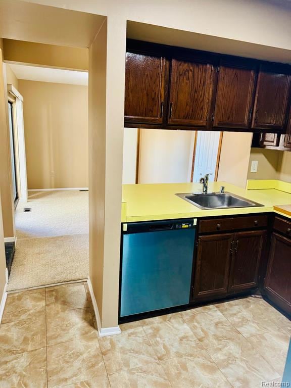 Kitchen featuring dark brown cabinetry, light countertops, and dishwasher