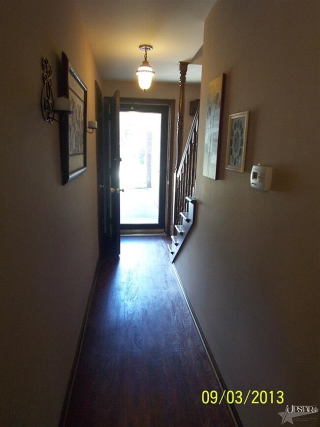 Newer laminate flooring welcomes you at the front 