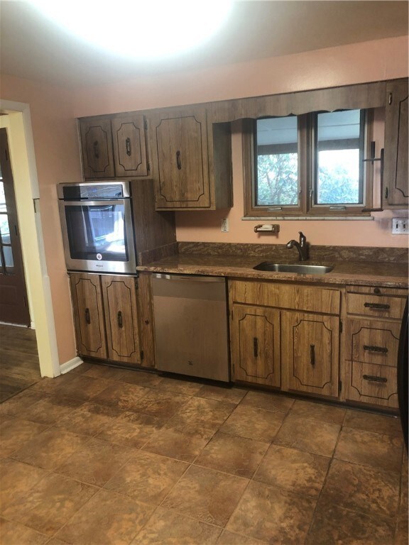 Kitchen is spacious and can be updated to your des