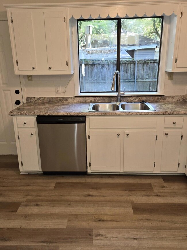 Updated kitchen with stainless steel dishwasher, n