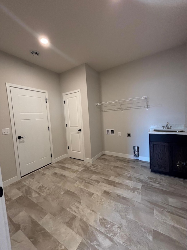 With the Mudroom/Laundry Room's close proximity to the kitchen, it keeps daily routines running smoothly—whether it’s unloading groceries, kicking off shoes, or tackling a quick load of laundry.