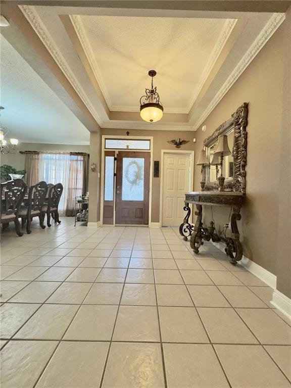 Foyer has trey ceilings and crown