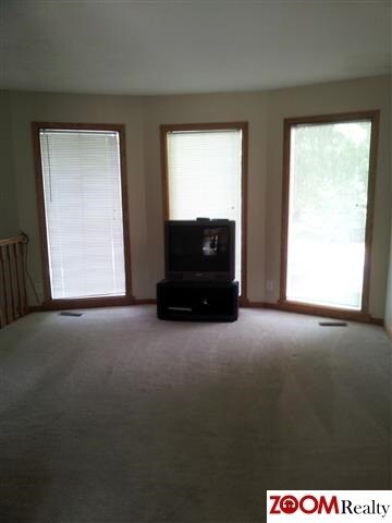 Walk-out bay window in living room gives not only extra square footage to this floor plan, but some wonderful natural light.  Enjoy life!