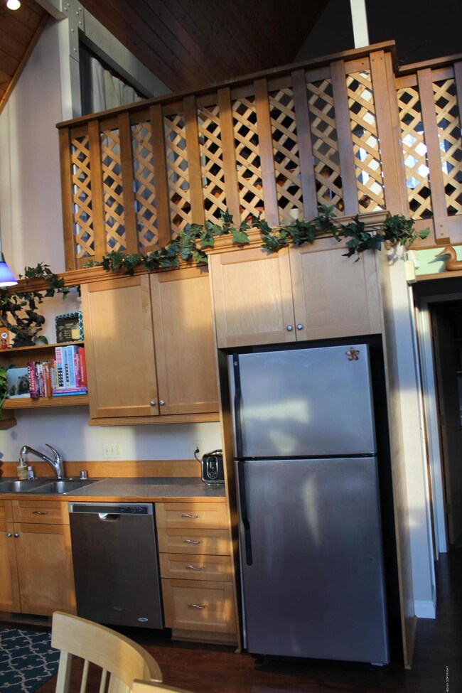 Kitchen looking up to loft