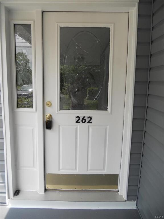 Come on in! Beautifully etched glass door and side