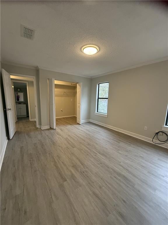 Unfurnished bedroom featuring ornamental molding, 