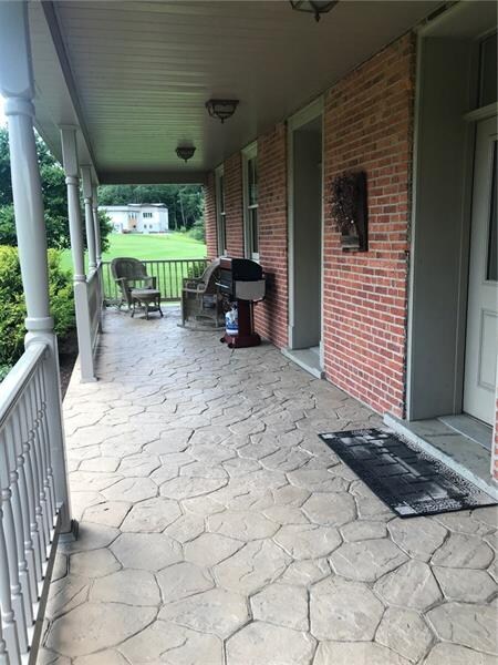 Cement patio on front porch.