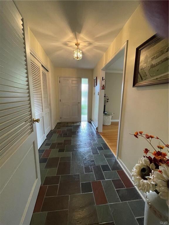 Foyer with slate floor and coat closet