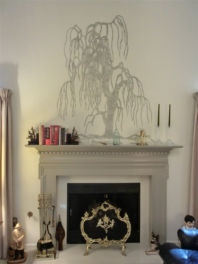 Hand drawn charcoal artwork above fireplace