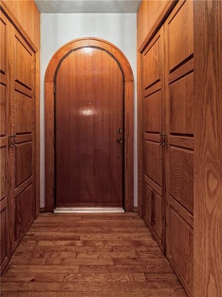 Entrance features a custom door and is flanked wit