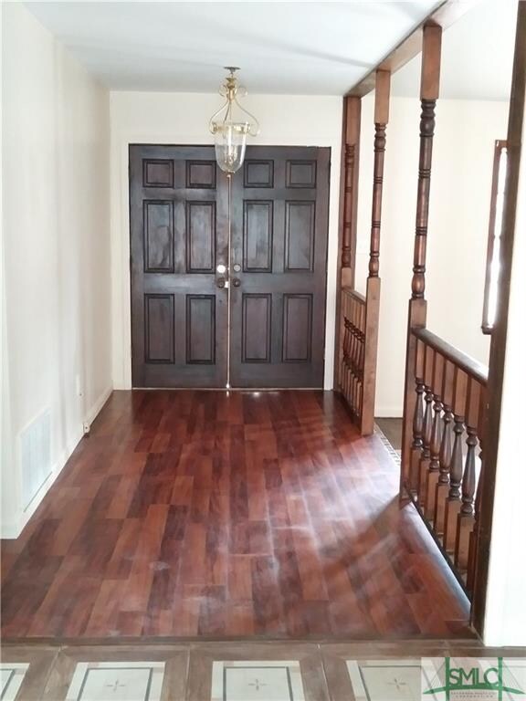 Double front door.  Fresh coat of paint throughout
