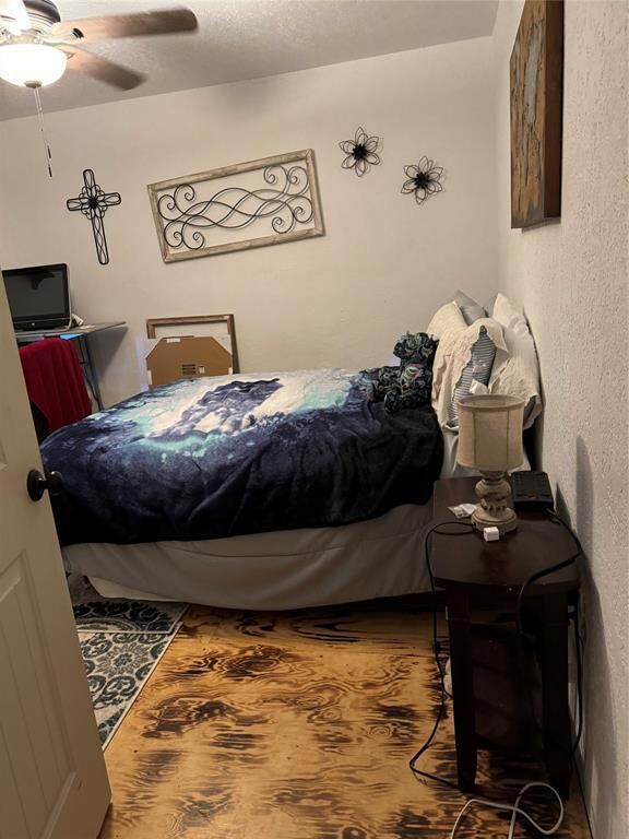 Bedroom featuring hardwood / wood-style flooring a
