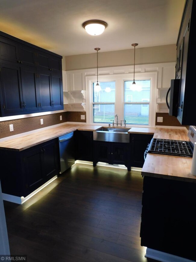 The new kitchen boasts butcher block counter tops,