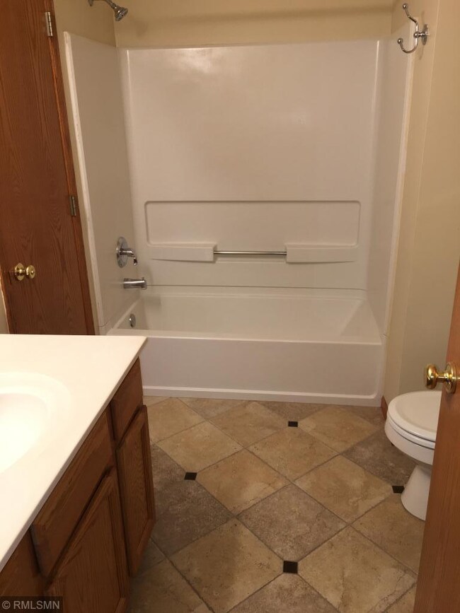 Walk-thru master bath room with ceramic floors