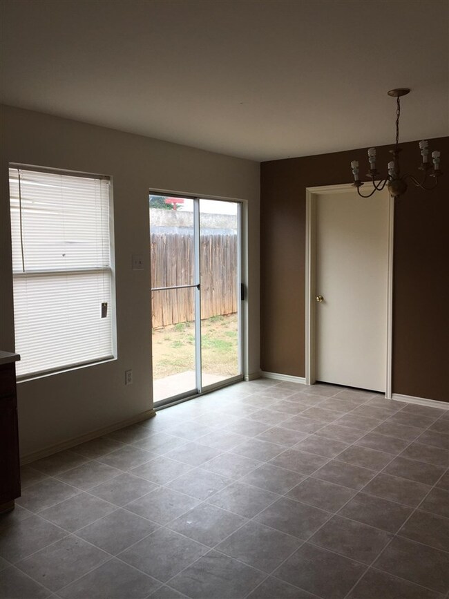 Open concept with sliding door to outside yard.