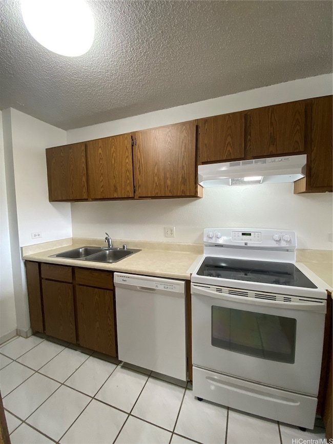 Enhanced Photo. Kitchen with range and dishwasher.
