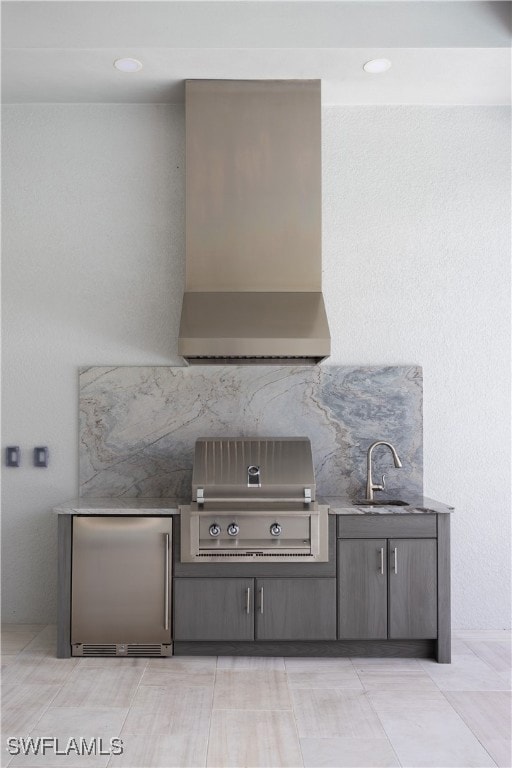 View of patio featuring area for grilling and a sink