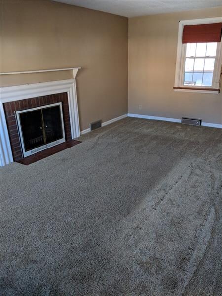 Living room with Dec. Fireplace.