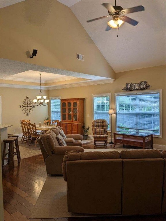 Vaulted ceiling, wood fireplace, and lots of windo