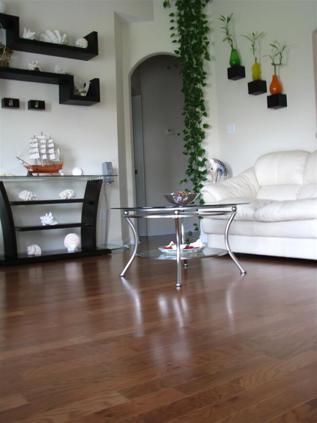 Great Room has hardwood flooring and a lovely gas 