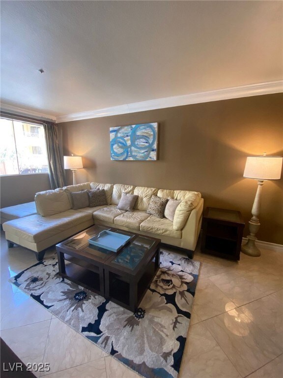 Living room with marble finish floor and ornamenta