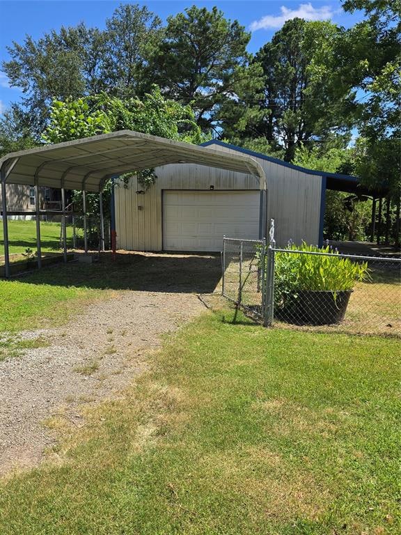 View of outdoor structure with dirt driveway