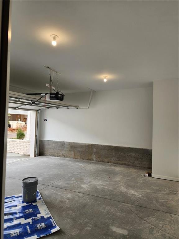 Garage featuring a garage door opener
