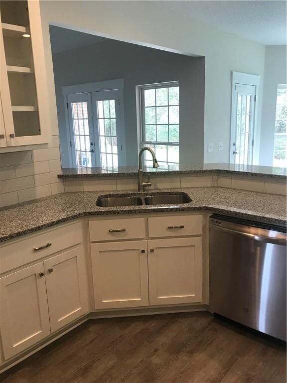Open Kitchen with Tiled Backsplash.  Custom Cabine