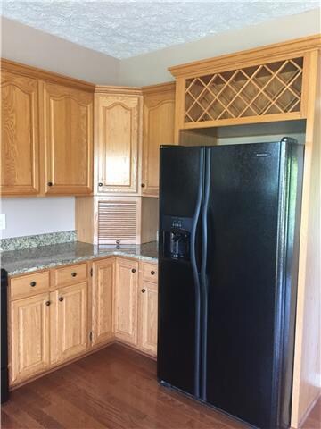 Notice the custom cabinetry with the built in wine rack.