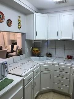 Kitchen has lots of cabinet space