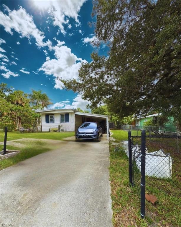 Single story home with concrete driveway