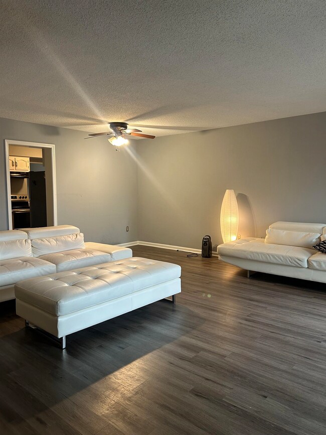 Bedroom featuring baseboards, wood finished floors