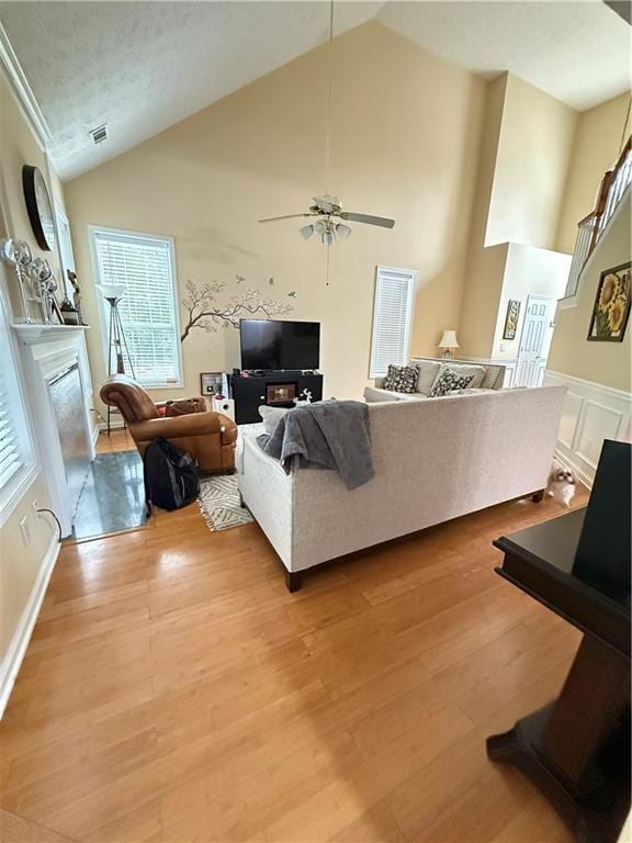 Living room with plenty of natural light, light wo
