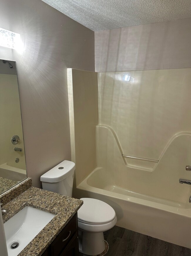 Full bathroom with tub / shower combination, vanit