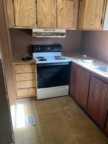 Kitchen with ventilation hood, visible vents, ligh