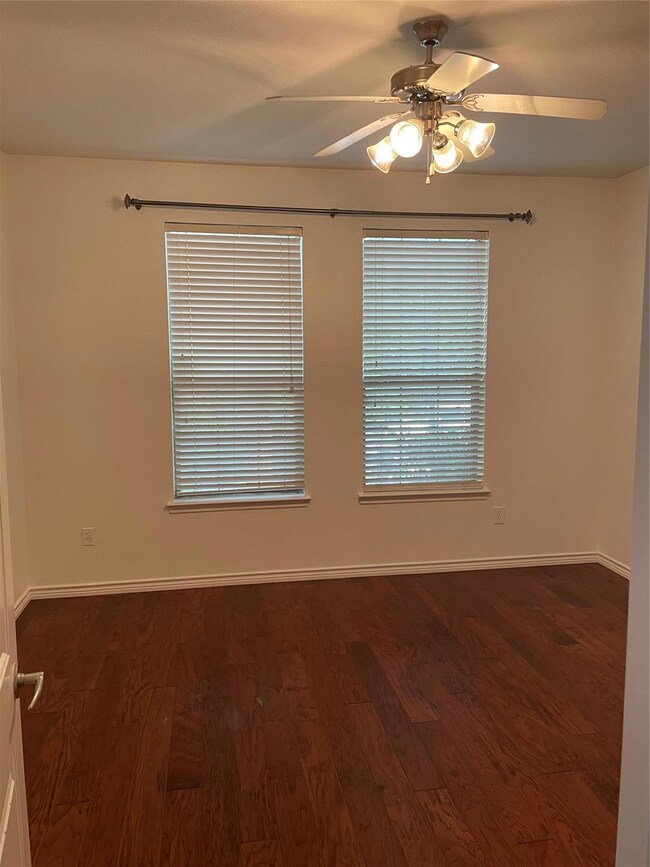 Master Bedroom room featuring dark hardwood / wood-style floors and ceiling fan