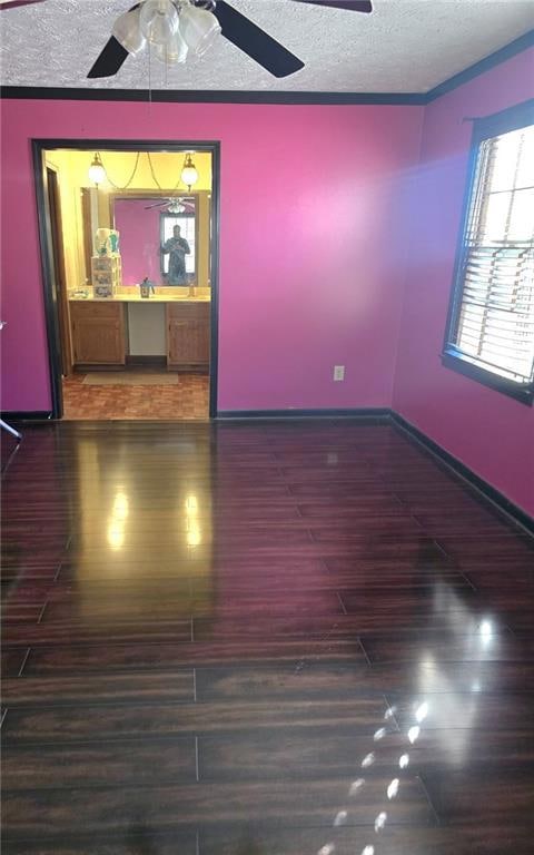 Empty room with dark hardwood / wood-style floorin