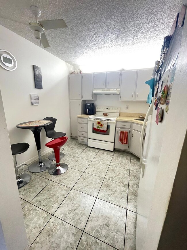 Spacious kitchen has eat-in area