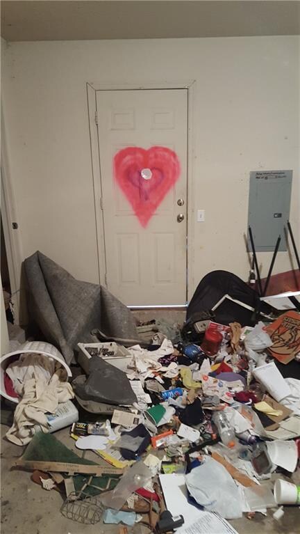 Garage & Living room covered in spray paint & tras