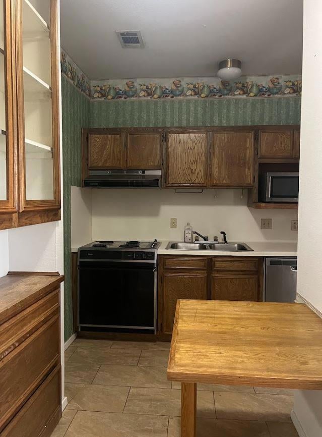 Kitchen with butcher block counters, stainless st