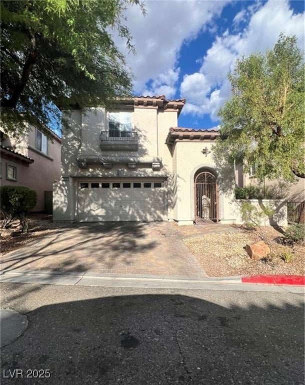Mediterranean / spanish-style house with an attach