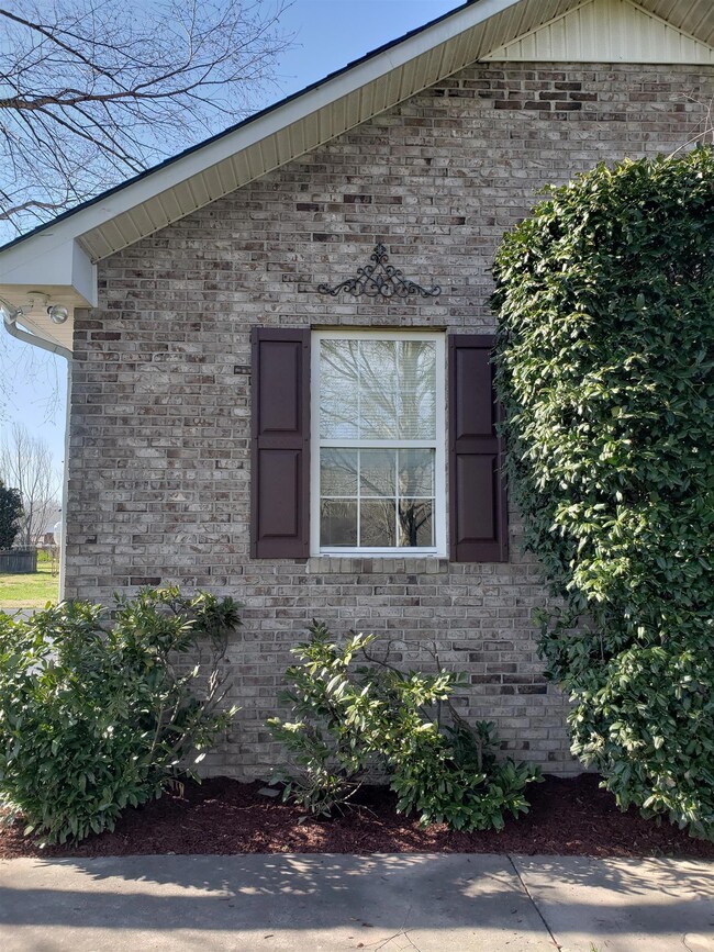 Well landscaped home with iron accents