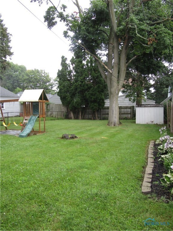 fence enclosed back yard with room to play - and y