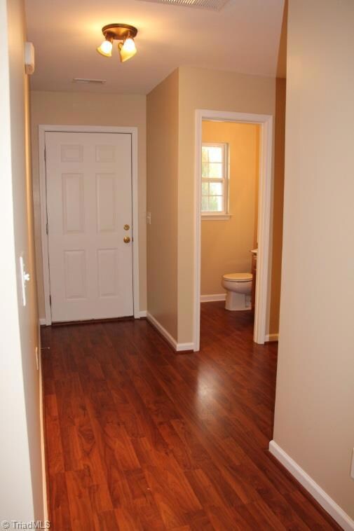 Inviting Foyer with Laminate Wood Flooring and Fresh Paint!