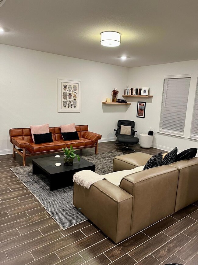 Living area featuring wood finish floors and base