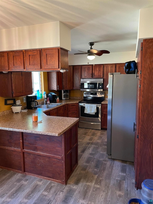 Kitchen featuring sink, appliances with stainless 