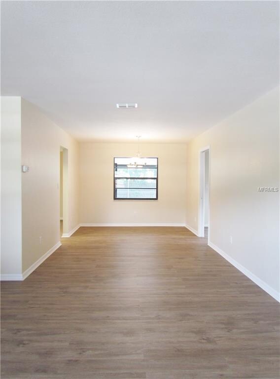 LIVING ROOM LOOKING INTO DINING AREA