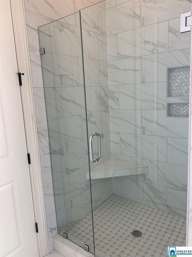 Frameless glass, soap niche, check out the pretty tile!